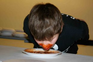 Dawson Connollly does his best to eat his plateful first.