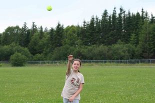 Dana Benoit Chubb practices for the softball throw competition at the 2011 Hershey North American Final, taking place this week in Hershey, Pa. - Christopher Vaughan photo