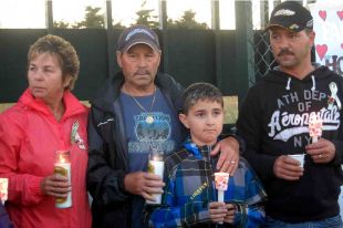 Carol King’s family, from left, her mother Yvonne, father Carl, nephew C.J. King and brother Cornelius King are seen at Wednesday’s vigil. — Star photo by Frank Gale