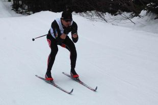 Brian Dunphy tucks in tight down a hill on the Whaleback Ski Club Trails on his way to a first-place finish at 44:57 in the Provincial Masters Classic event on Saturday.